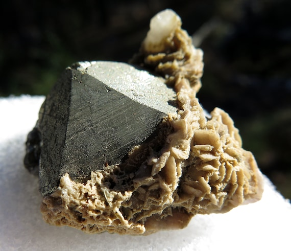 Slightly Iridescent Pyrite crystal with Rhodochrosite. Nacozari de Garcia, Sonora, Mexico. Natural termination. 1.75 inch across