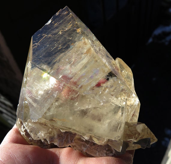 A complete Honey color Calcite Crystal with rainbows in excellent condition. Elmwood mine, Carthage, Tennessee USA. 4.25 inch