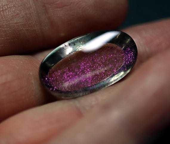 Covellite included quartz. Pink fire. 21.15 carat. Excellent flash both sides. See video
