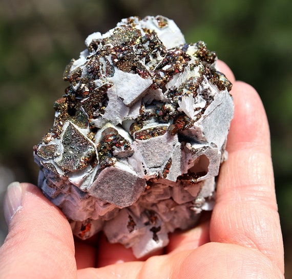 Quartz, iridescent rainbow pyrite, calcite pseudomorph after fluorite, Nikolaerskiy mine, Dalnegorsk, Russia 3 inch. See video