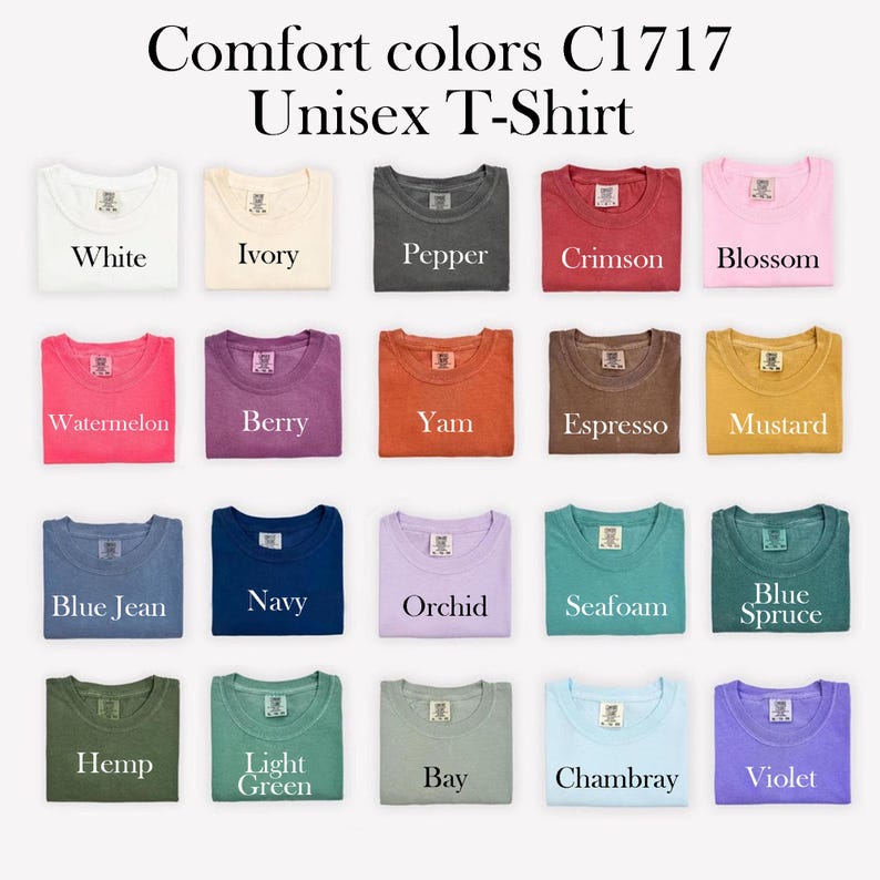 May include: A selection of Comfort Colors C1717 Unisex T-shirts in a range of colours. The colours include white, ivory, pepper, crimson, blossom, watermelon, berry, yam, espresso, mustard, blue jean, navy, orchid, seafoam, blue spruce, hemp, light green, bay, chambray, and violet.