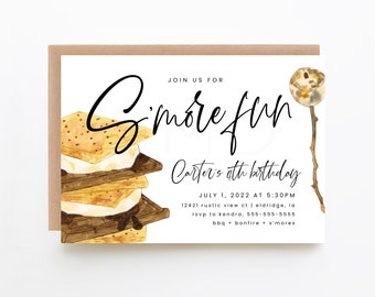 May include: A white invitation card with a brown border features the text "S'more fun" in elegant script. The card includes watercolor illustrations of s'mores and a roasted marshmallow on a stick. The text also includes the date, time, and location for a birthday party.