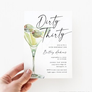 May include: A white invitation card with a green watercolor illustration of a martini glass with olives. The text on the card reads "Dirty Thirty", "Join us for a 30th Birthday for Britteny Andrews", "September 2, 2022 at 11:00am", "Jones Tap Room 5195 Utica Ridge Rd. Davenport, IA", "RSVP to Jan | 555-555-5555", "Light apps + brews served."