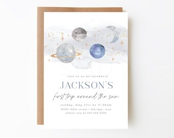 May include: A white invitation card with a blue watercolor background featuring a crescent moon, stars, and planets. The text on the card reads "Join us as we celebrate Jackson's first trip around the sun. Sunday, May 21st at 11:30 am. 10234 130th Street, Eldridge, Iowa. Please RSVP to 555-555-5555."