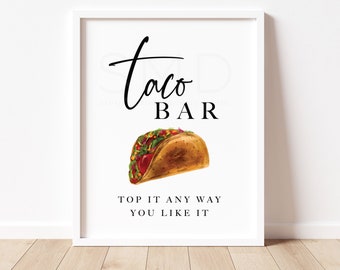 May include: A white printable sign with black text that reads "Taco Bar" and a watercolor illustration of a taco. The text below the taco reads "Top it any way you like it".
