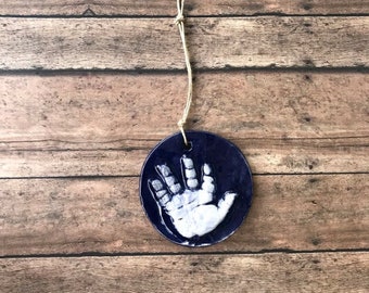 Single Handprint 3-4 Inch Circle Ornament Kit in Navy Blue for Newborns Strung on Natural Twine & in a variety of other colors.