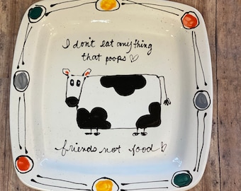 I don’t eat anything that poops vegan plate hand painted with Cow and retro design.