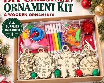 May include: A DIY Christmas ornament kit in a cardboard box containing four wooden ornaments shaped like a candy cane, an elf face, a gingerbread person, and a round bauble, along with colorful markers, pipe cleaners, and pom-poms.