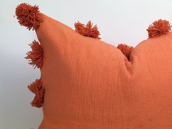 Orange pom pom cushion online