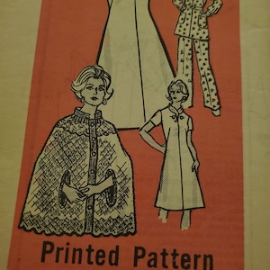 May include: Vintage printed pattern with illustrations of women's clothing designs. The designs include a long dress, a two-piece pajama set, a cape, and a short-sleeved dress. The text "Printed Pattern" is visible, along with the size 18 1/2.