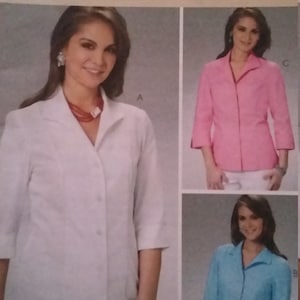 May include: McCall's sewing pattern for a classic fit shirt. The pattern features three shirt variations in white, pink, and blue. The text on the pattern reads "The Perfect Shirt" in English, French, and Spanish.