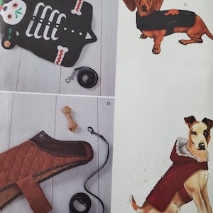 May include: A page featuring dog clothing and accessories. Includes a black skeleton-shaped dog coat with a leash, a brown quilted dog coat with a leash, and illustrations of dogs wearing coats.