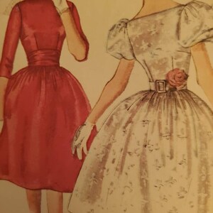 May include: Vintage dress patterns featuring two dresses. One is a red, knee-length dress with a fitted bodice and a flared skirt. The other is a white dress with a floral pattern, a cinched waist, and a rose detail.