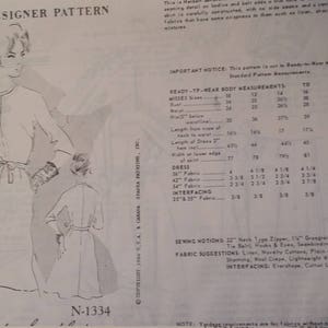 May include: A vintage sewing pattern for a dress with a long skirt and a fitted bodice. The pattern is for size 14 and is called "Spadea Designer Pattern N-1334". The pattern includes instructions for sewing the dress and a list of fabric suggestions.