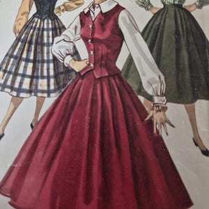 May include: A vintage sewing pattern illustration featuring three outfits. The central figure wears a long-sleeved white blouse under a button-front burgundy vest with a matching full skirt. Flanking figures display a plaid skirt and a solid green skirt.