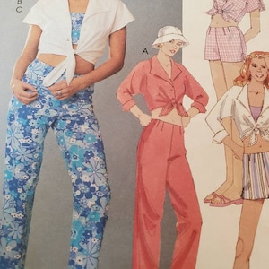 May include: A vintage sewing pattern featuring illustrations of women's clothing. The designs include a white tie-front shirt, floral print pants, a pink button-up shirt, and a gingham shorts set. The outfits are in various colors.