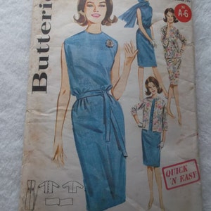 May include: Vintage Butterick sewing pattern showing a blue dress with a belt, and a matching jacket. The pattern includes illustrations of the dress and jacket. The text reads "QUICK 'N EASY". Bust 32, size 12.