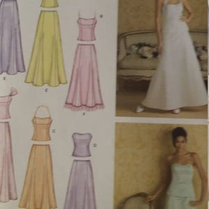 May include: Simplicity sewing pattern featuring various formal dress designs. The pattern includes illustrations of dresses in colors like lavender, yellow, and pink. The image also shows two women modeling dresses, one white and one light green.