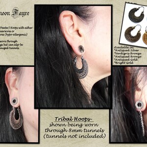May include: Darkmoon Fayre tribal hoops in various finishes, including antiqued silver and bright gold. The image shows the earrings being worn through 8mm tunnels. The earrings are made of Tibetan Silver (Pewter) with Sterling Silver or Niobium earwires.