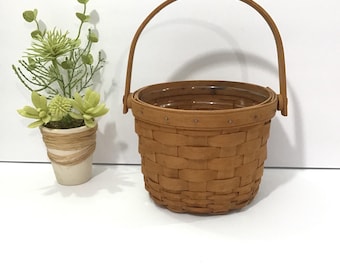Cesta redonda Longaberger 1992, inserto de plástico, asa oscilante