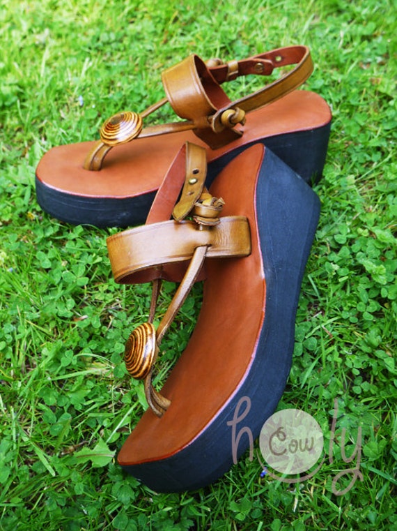Two pairs of rope wedge sandals: - One in monogrammed d…