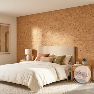 May include: A bedroom with a neutral color palette. The bed has a cream-colored duvet and decorative pillows. A cork wall serves as a headboard. Two wooden nightstands flank the bed, each with a lamp. A framed abstract artwork hangs on the wall.