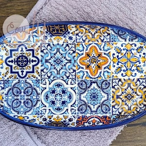 May include: Oval ceramic serving tray with a blue, white, and yellow patterned design reminiscent of traditional Portuguese tiles.