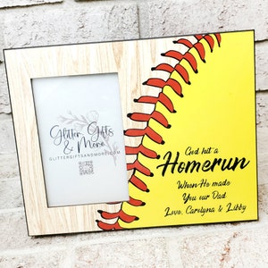 May include: A wooden picture frame with a yellow softball graphic and the text "God hit a Homerun When He made You our Dad Love, Carolyna & Libby".