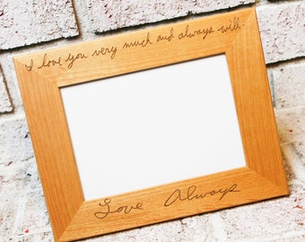 May include: A wooden picture frame with a white mat and a handwritten message that reads "I love you very much and always will. Love Always".