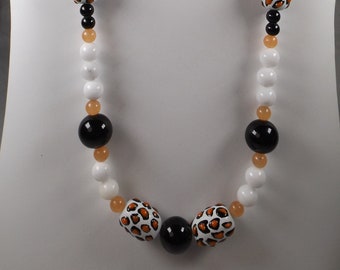 Animal Print Beaded Necklace 25" Length with White, Black and Soft Orange Colors - Silvertone Finishes Lobster Claw