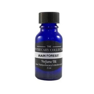 May include: A small blue glass bottle with a black cap and a white label that reads "The Apothecary Collection" and "Rain Forest Perfume Oil".