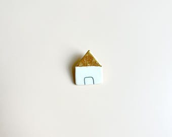 Porcelain brooch House