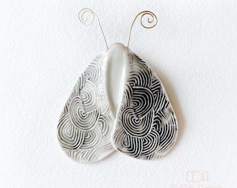 White and black spiral moth porcelain brooch