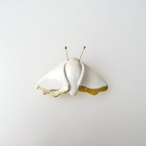 White moth and gold leaf porcelain brooch