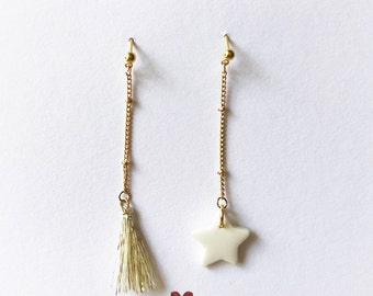 Mismatched stud earrings and star chain in porcelain and pompom