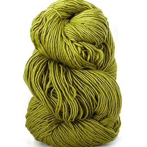 May include: A skein of green yarn, a soft and textured material for knitting or crocheting.