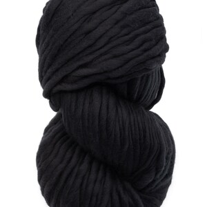 May include: A large ball of black yarn, ideal for knitting or crocheting chunky projects.