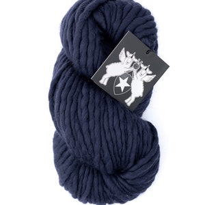 May include: A skein of navy blue chunky yarn. The yarn is made of wool and is ideal for knitting or crocheting.