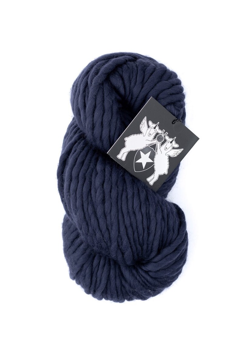 May include: A skein of navy blue chunky yarn. The yarn is made of wool and is ideal for knitting or crocheting.