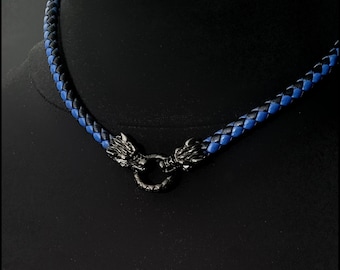 May include: A black and blue braided leather choker necklace with a silver dragon head clasp.