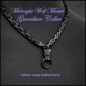 May include: Black metal chain necklace with a wolf head pendant. The necklace has a lobster clasp behind the neck. The text "Midnight Wolf Master Guardian Collar" is written on the image.