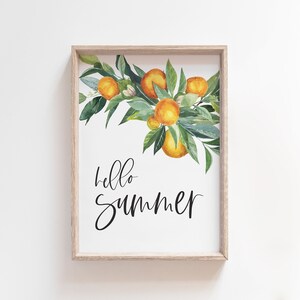 May include: A framed print featuring a watercolour illustration of a branch of orange blossoms and the text "hello summer" in black script.