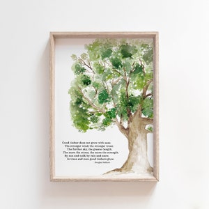 May include: A watercolor painting of a tree with green leaves and a brown trunk. The painting is framed in a light wood frame. The quote "Good timber does not grow with ease: The stronger wind, the stronger trees; The further sky, the greater length; The more the storm, the more the strength. By sun and cold, by rain and snow, In trees and men good timbers grow." by Douglas Malloch is printed below the tree.
