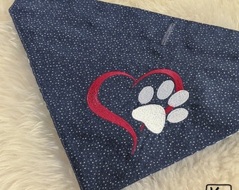 May include: A blue bandana with white polka dots and a red heart with a white paw print inside.