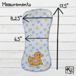 Baby burping cloth made with soft flannel rubber ducky design and accented with an embroidered rubber duck and detail stitching all through the edge.