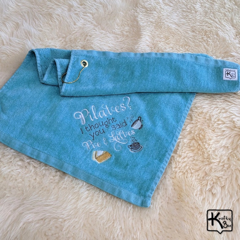 Handmade Pilates towel with funny embroidered sign Pilates I Thought You Said Pie & Lattes design and gold color corner grommet with hook. All our towels are pre-washed before embroidering the design to make sure the design doesn’t change.