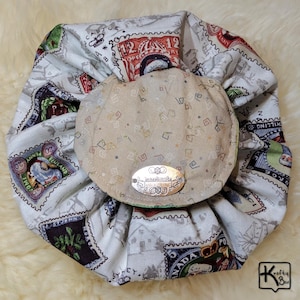 May include: A white ceramic mug with a black handle and the text "But First, Coffee" in a bold, black font. The mug is set against a neutral background, highlighting its simple design.