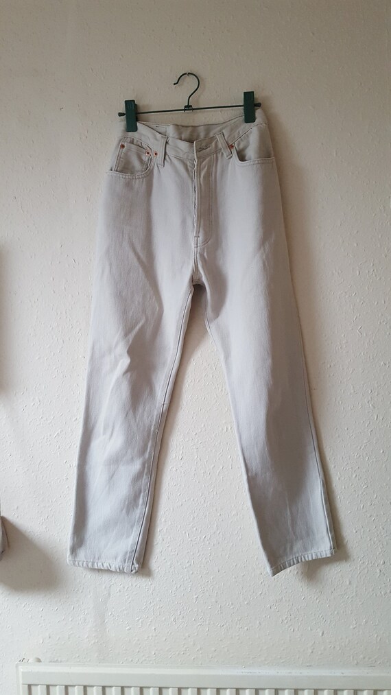 cream levis jeans