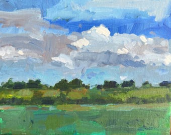 May include: An oil painting on canvas depicting a landscape with a vibrant green field in the foreground, a line of dark green trees in the middle ground, and a bright blue sky filled with thick, textured white and gray clouds above the horizon.