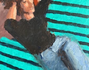 May include: An oil painting on canvas depicting a figure with reddish-brown hair wearing a black long-sleeved shirt and light blue jeans. The figure is reclining against a background featuring bold, horizontal stripes in alternating teal and dark blue.